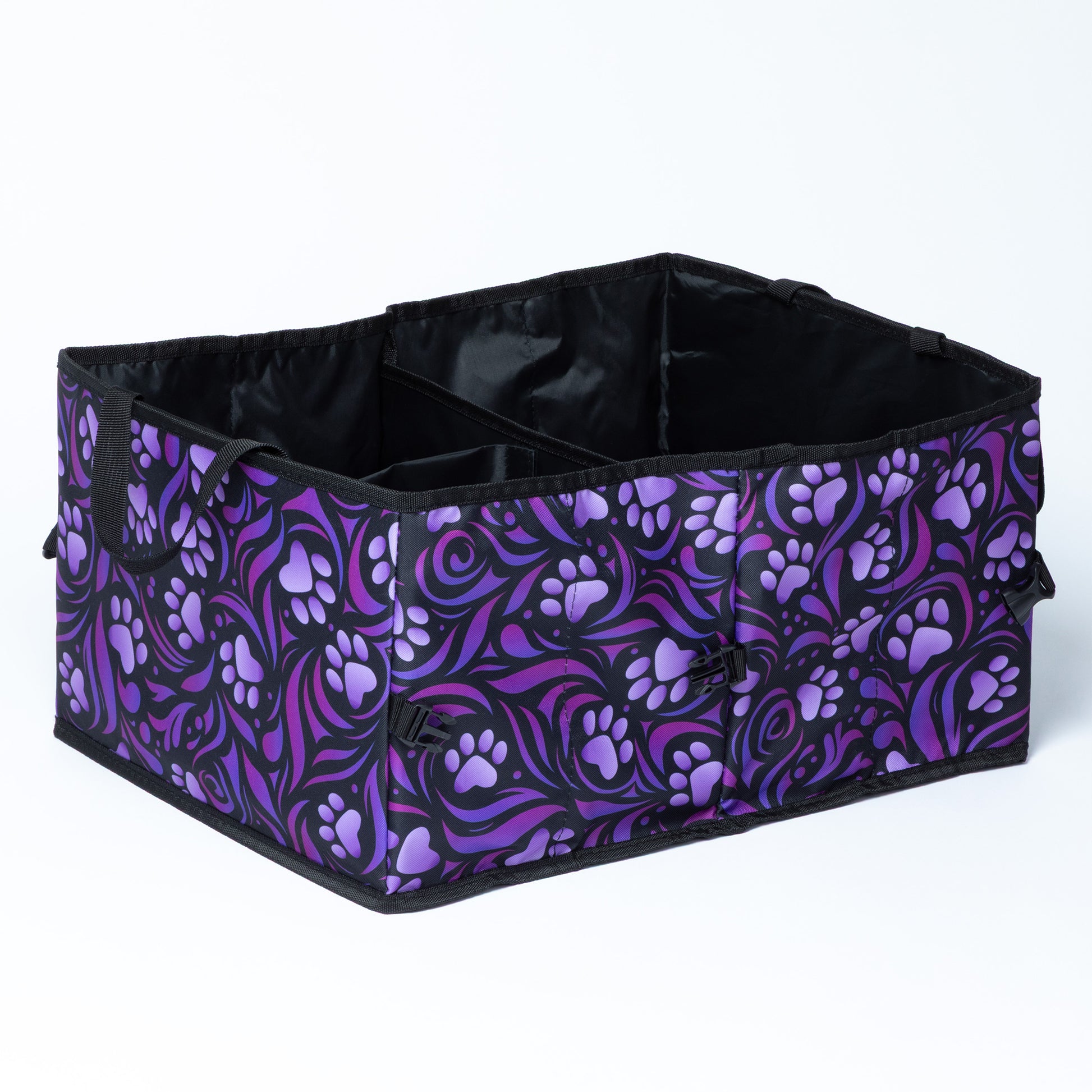 A collapsible car trunk organizer with a purple paw print design, against a white background.