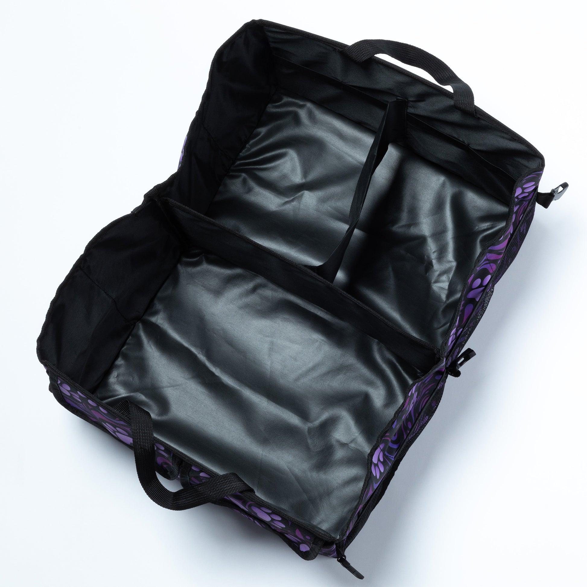 View from above showing the 3 large compartments of the paw printed car trunk organizer.