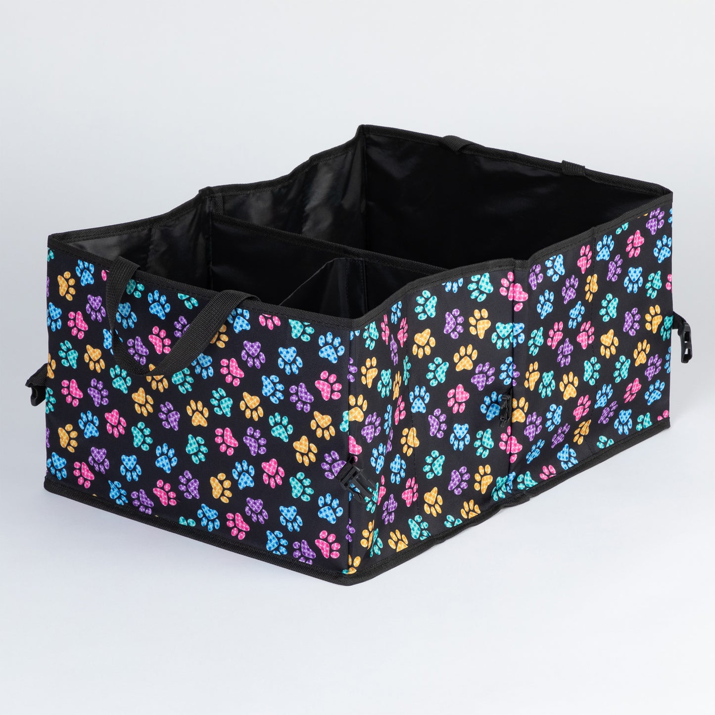 A paw print patterned car trunk organizer with pockets on the front, and a mesh pocket on the side, on a white background.