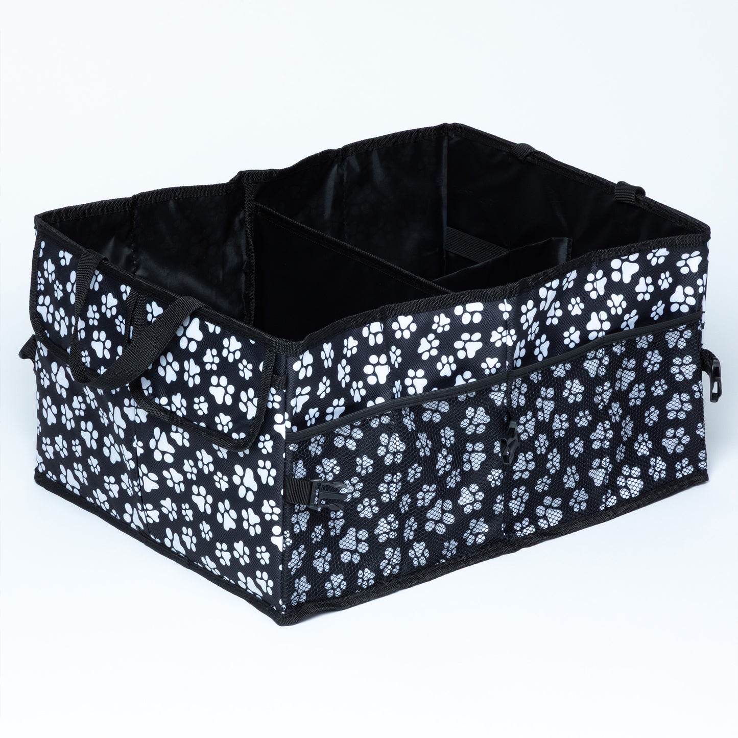 A black and white collapsible car trunk organizer with paw print designs