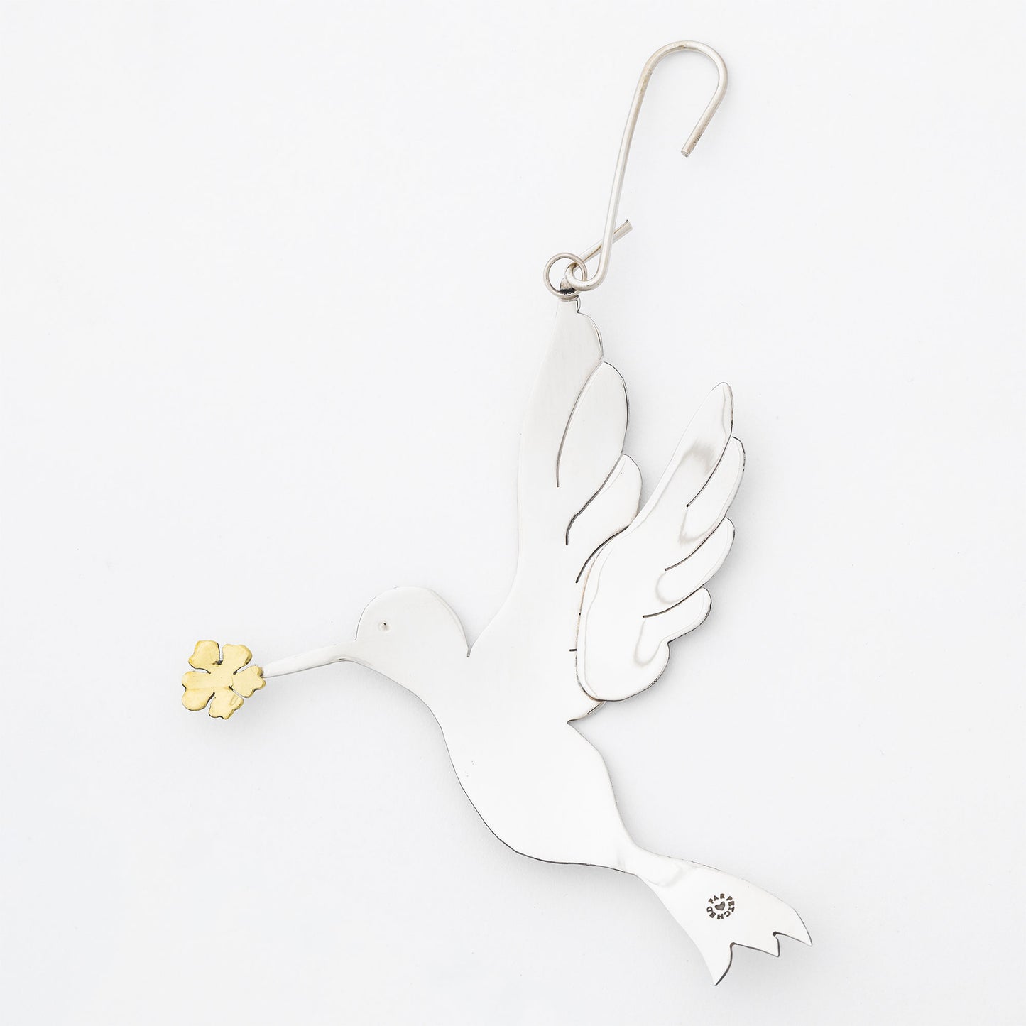 Decorative silver tone dove ornament with gold accents on a white background