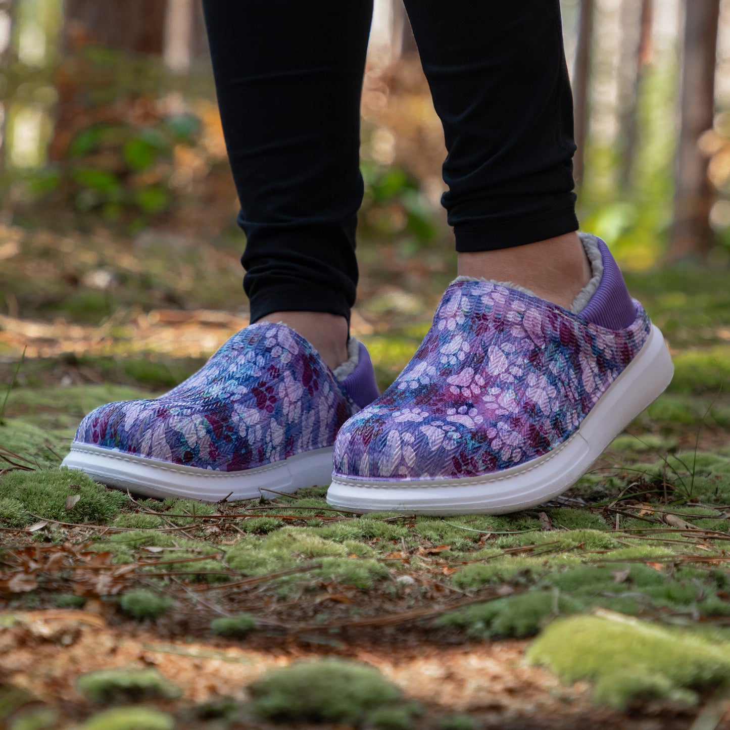 Floral patterned shoes worn in a forest setting