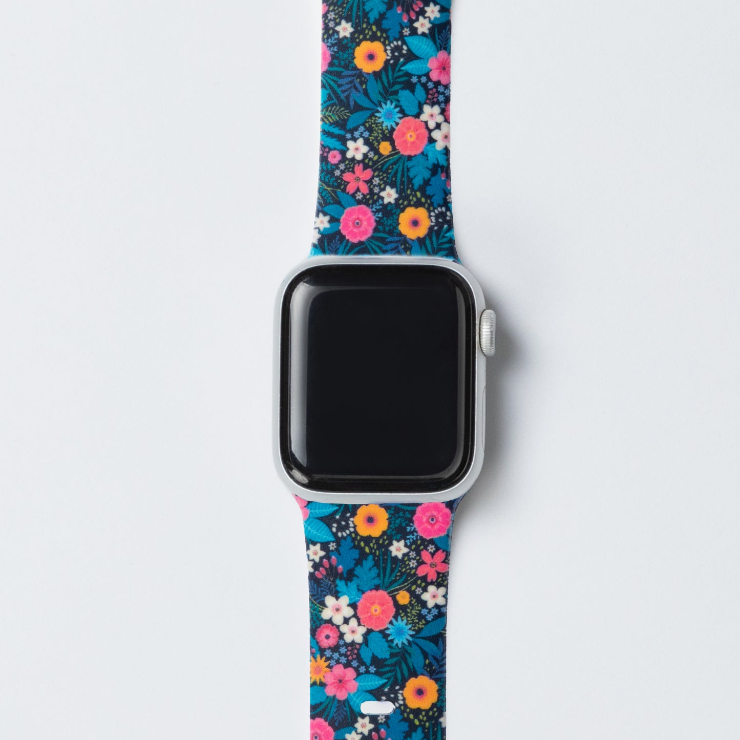 Smartwatch with a colorful floral patterned band on a light gray background
