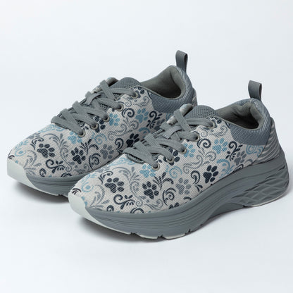 Gray sneakers with floral and paw print pattern on a white background.
