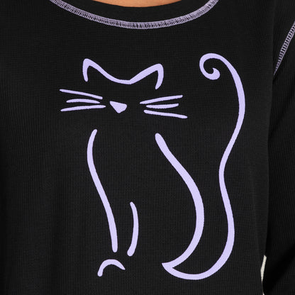 Black shirt featuring a playful purple cat graphic design on the front.