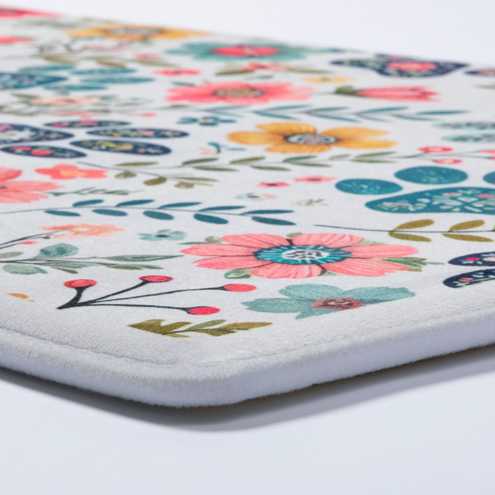 Floral patterned mat on a white background
