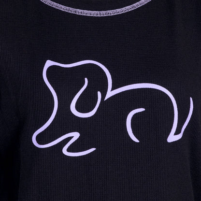 Black fabric featuring a minimalist purple line drawing of a playful dog.