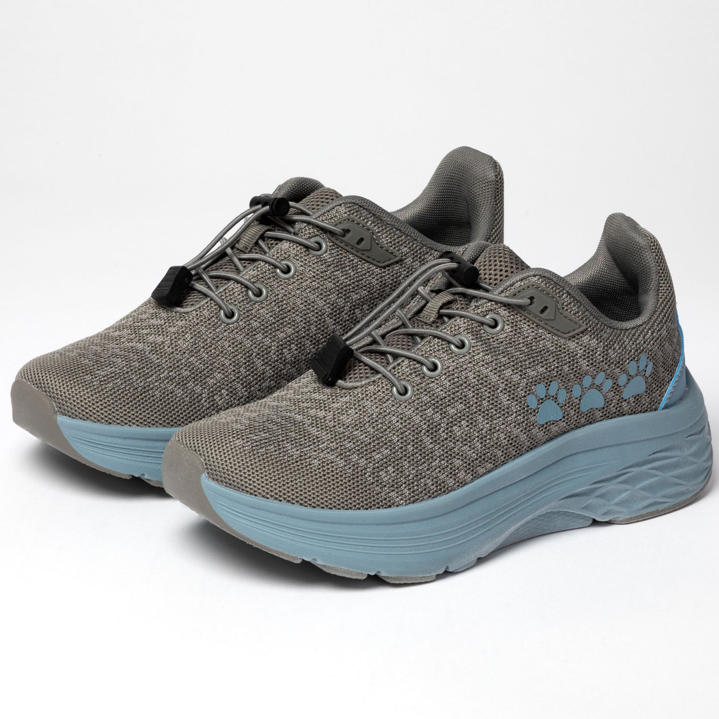 Gray running shoes with blue soles and three blue paw prints on the side, on a white background