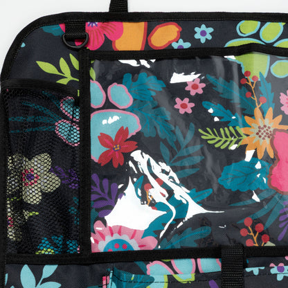 Backpack with colorful floral and mountain design on a black background