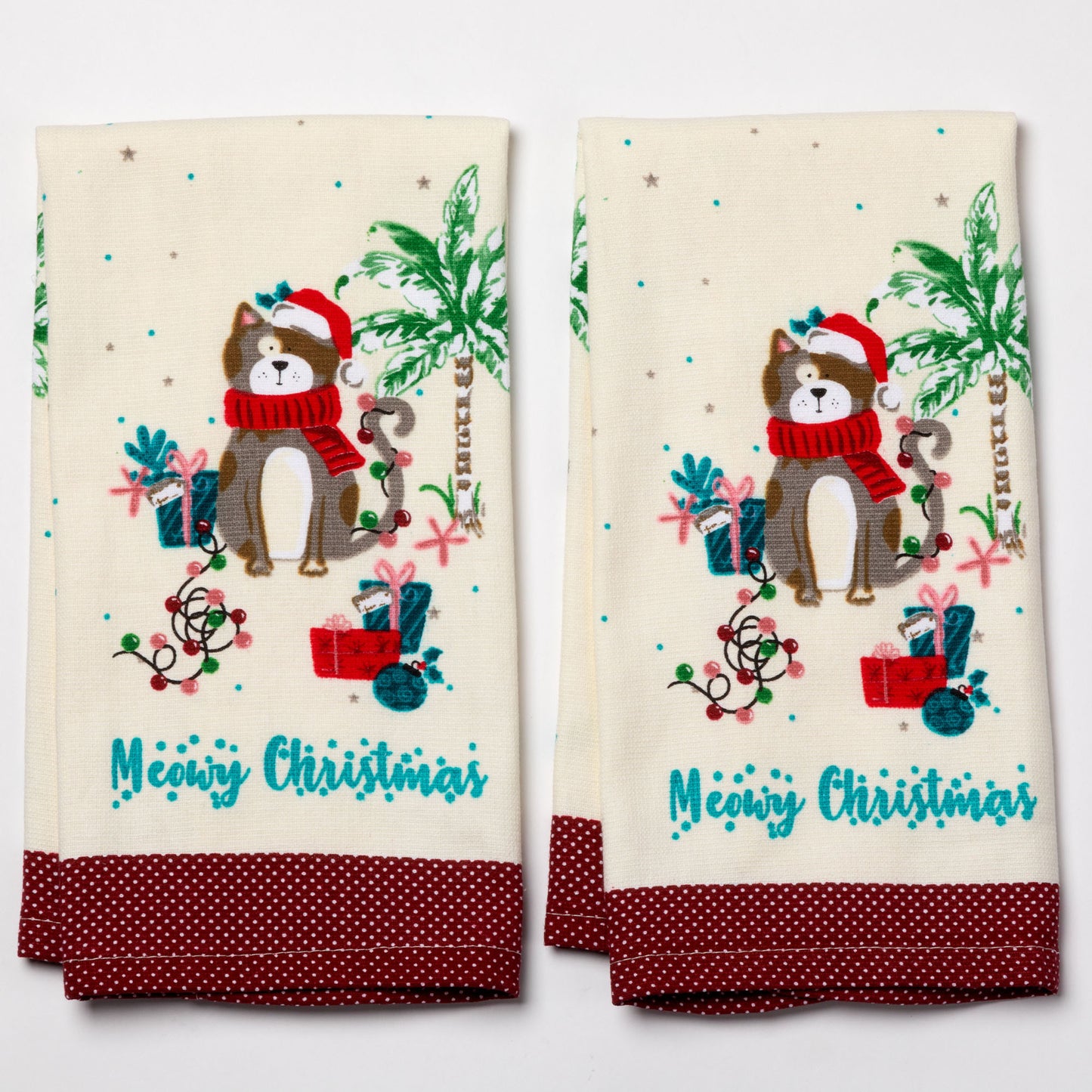 Two Christmas-themed towels with a cat illustration and 'Meowy Christmas' text on a white background.