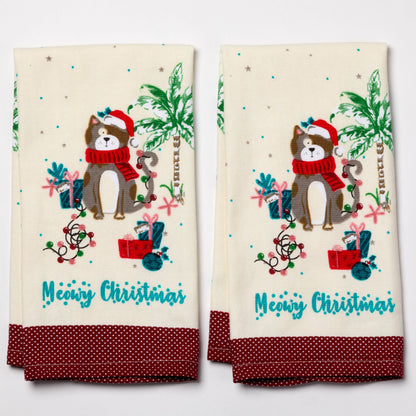 Two Christmas-themed towels with a cat illustration and 'Meowy Christmas' text on a white background.