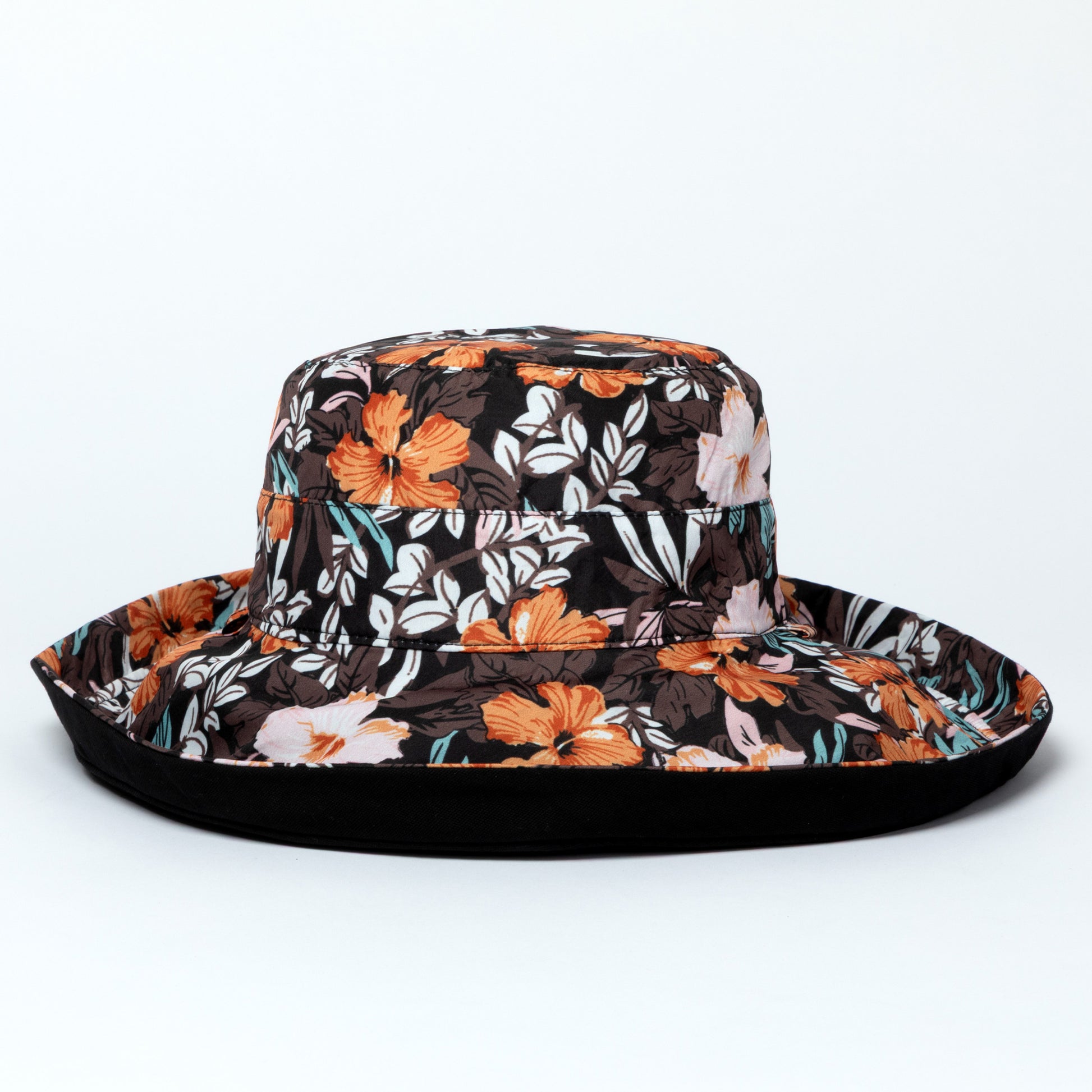 Floral patterned wide brim sun hat on a white background