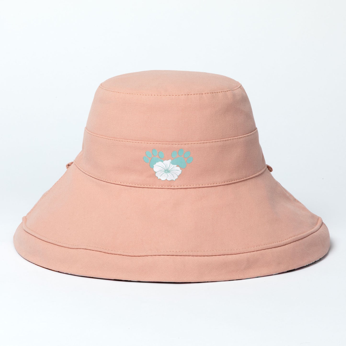 Pink wide brim sun hat with a floral design on a light gray background