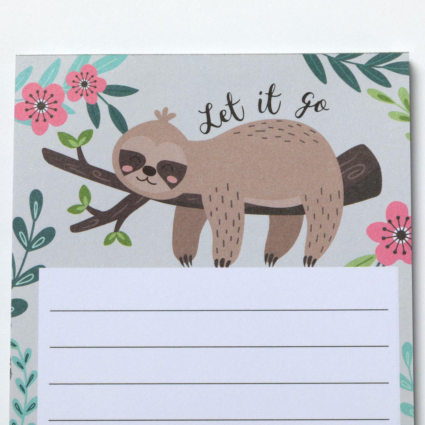 Notepad with a sloth illustration and floral design on a light gray background.