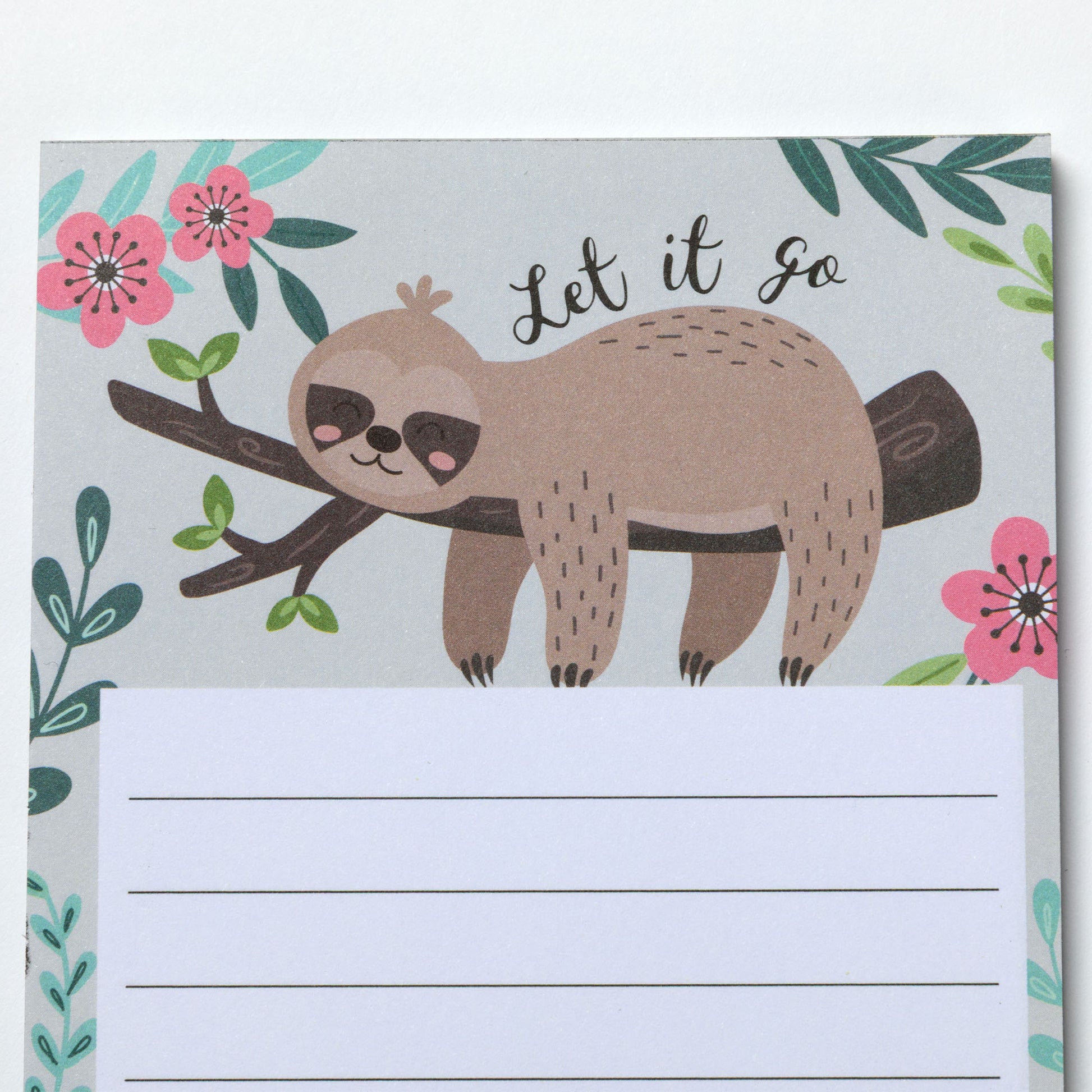 Notepad with a sloth illustration and floral design on a light gray background.