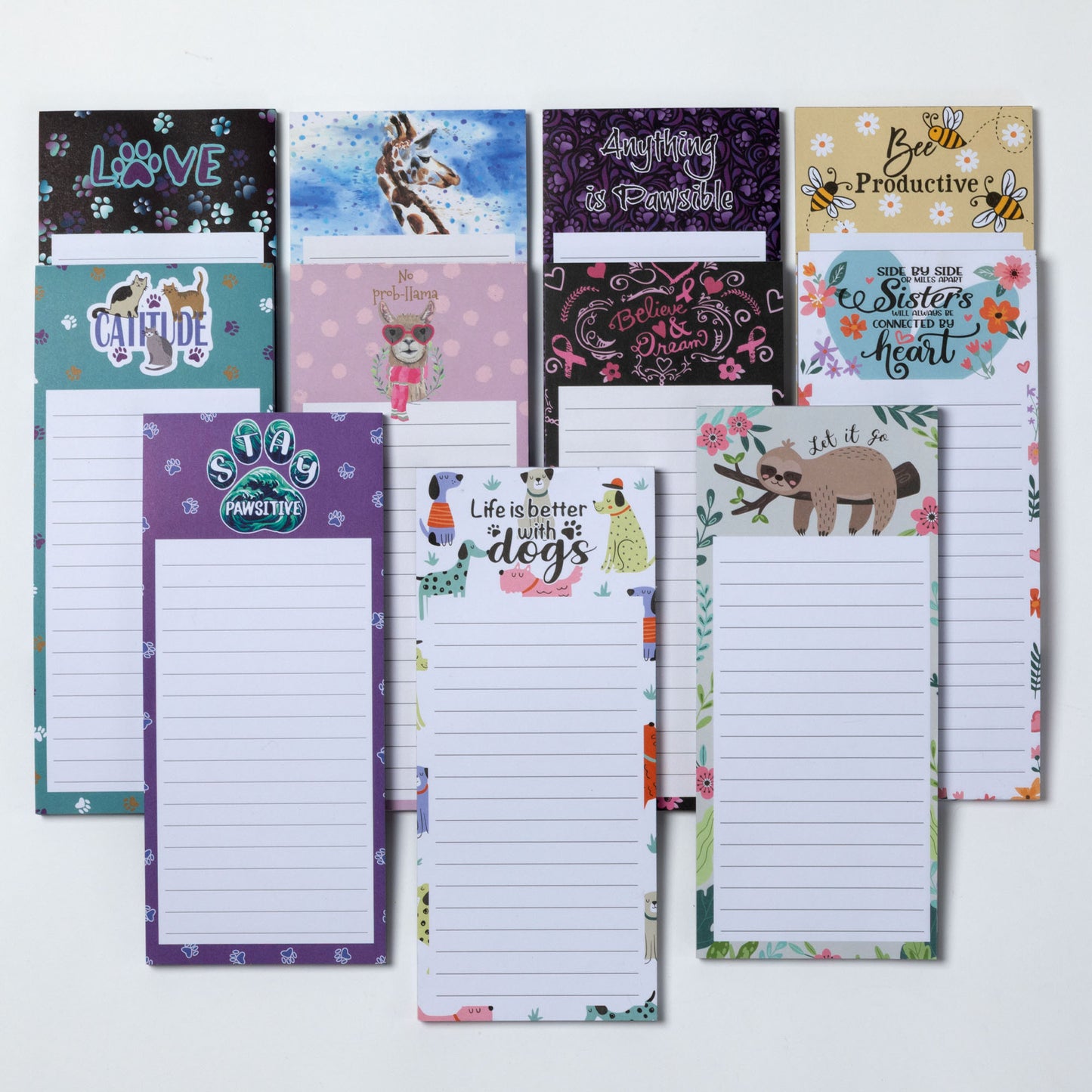 Collection of various themed notepads on a white background