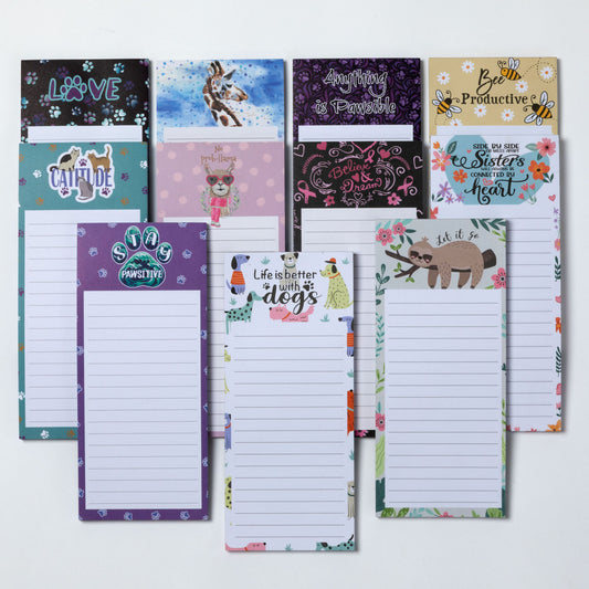 Collection of various themed notepads on a white background