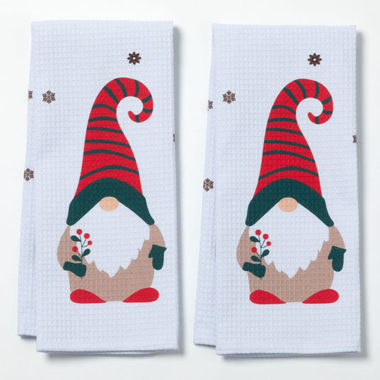 Two kitchen towels with Christmas gnome design on a white background
