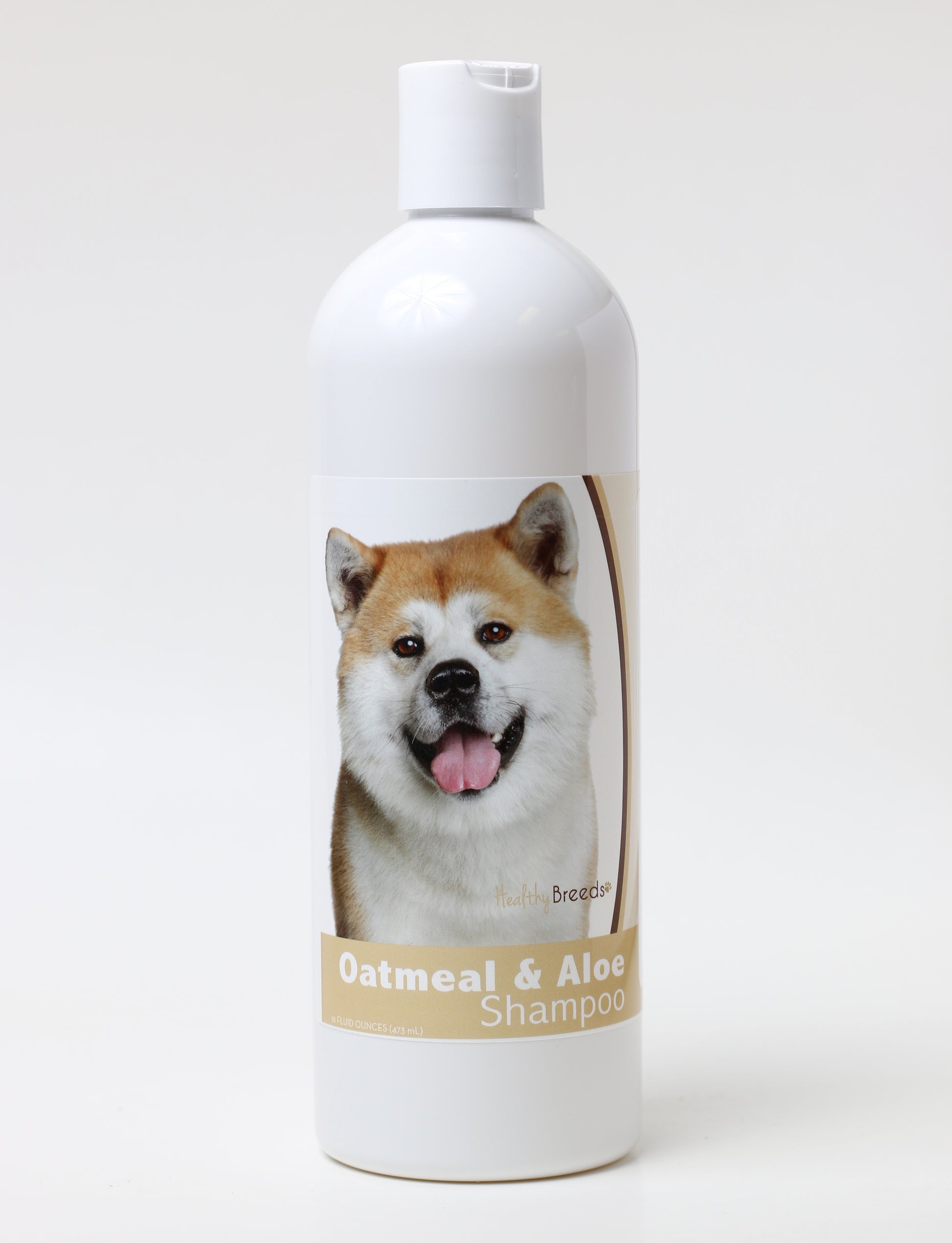 Oatmeal and aloe dog shampoo bottle with an Akita dog image on the label.