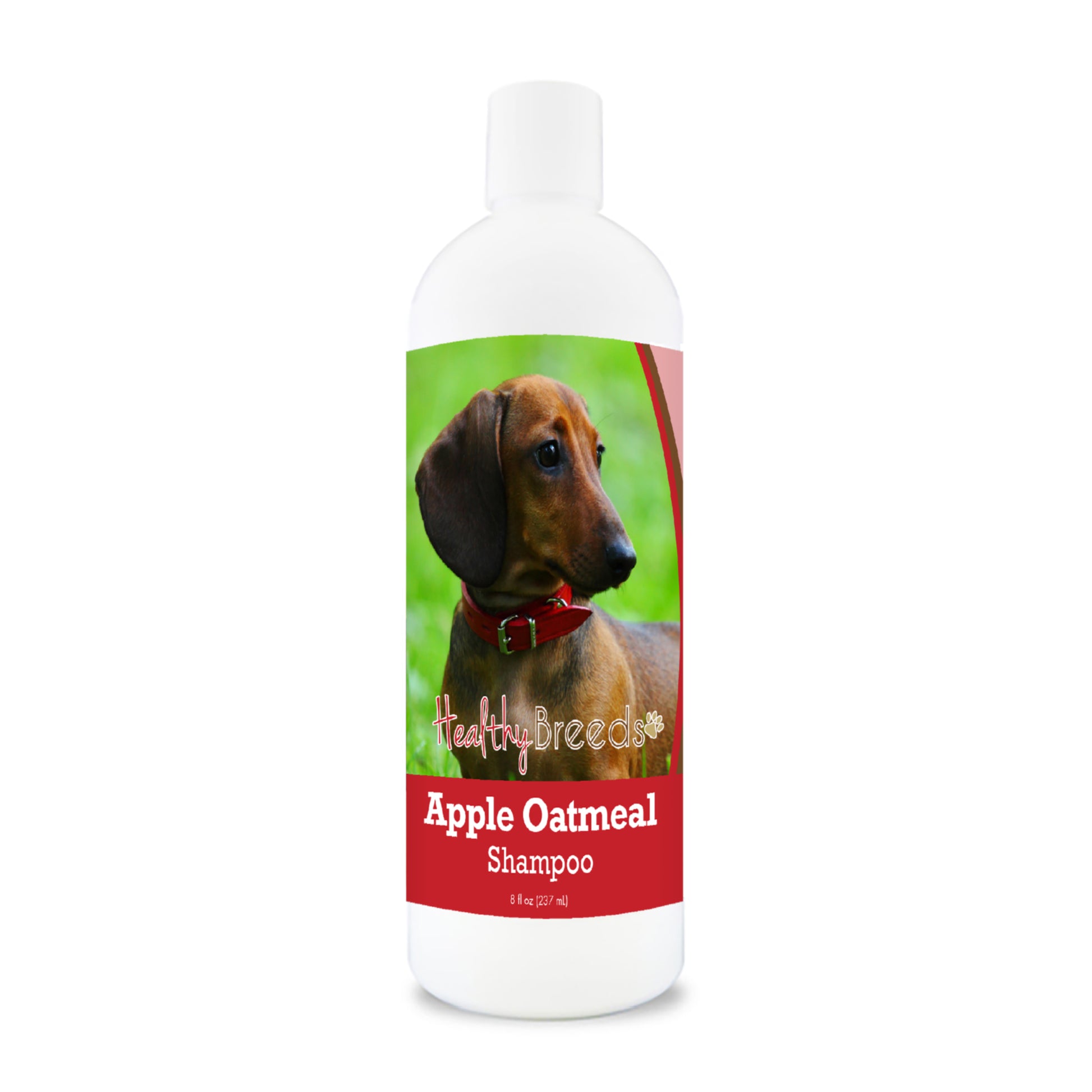 Bottle of apple oatmeal shampoo for dogs featuring specific dog breeds on each label.