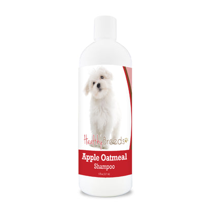 Bottle of apple oatmeal shampoo for dogs featuring a specific dog breed on each label.