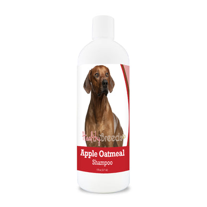 Bottle of apple oatmeal shampoo for dogs featuring a specific dog breed on each label.