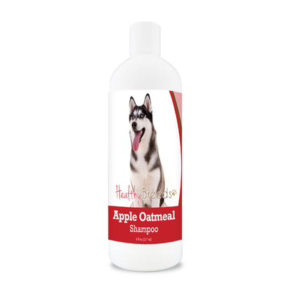 Bottle of apple oatmeal shampoo for dogs featuring specific dog breeds on each label.