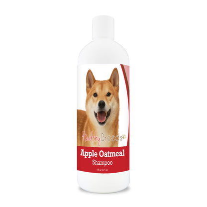 Bottle of apple oatmeal shampoo for dogs featuring a specific dog breed on each label.