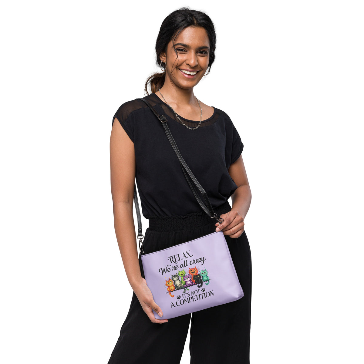 Woman holding a purple handbag against a white background