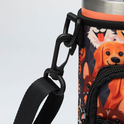 Close-up of a insulated bottle sleeve with a black carabiner clip and black shoulder strap, featuring a colorful cartoon dog print on a white background.
