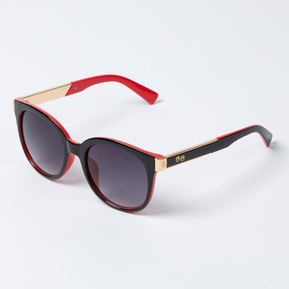 Sunglasses with black lenses and red and gold frames on a white background