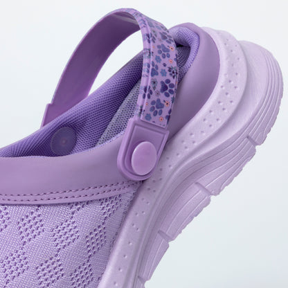 Purple clog with floral strap on a light purple background