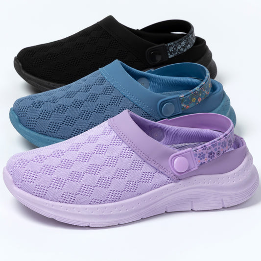 Purple, blue, and black clogs on a white background