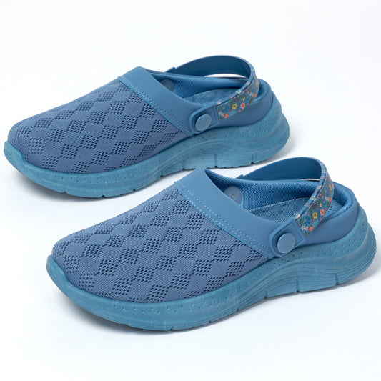 Pair of blue clogs with a knitted upper on a white background