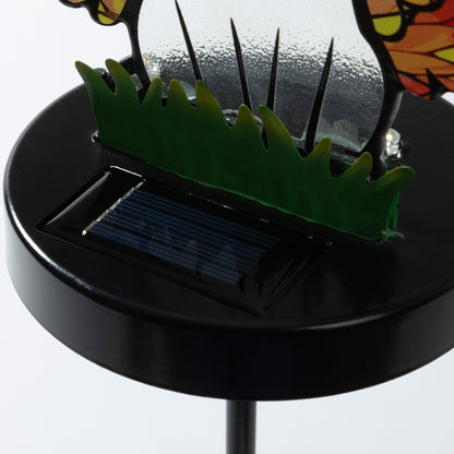 Close up of solar panel on a dog themed garden stake.