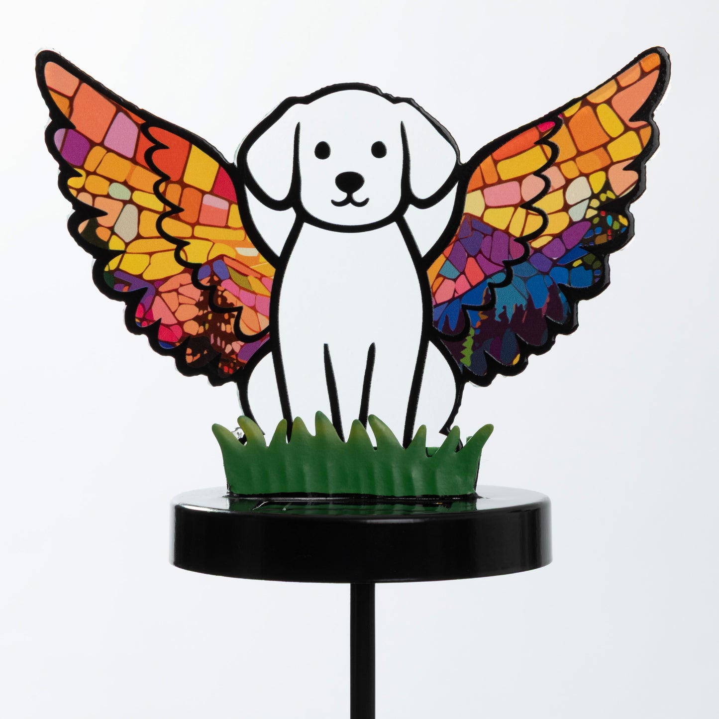 Dog silhouette with mosaic angel wings on a garden stake, against a white background.