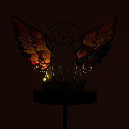 Glowing dog angel garden stake, shown on a white background, and in the dark with the light glowing.