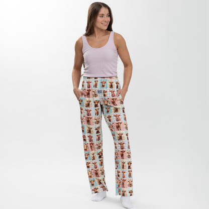Woman wearing pajama pants with highland cow pattern on a white background