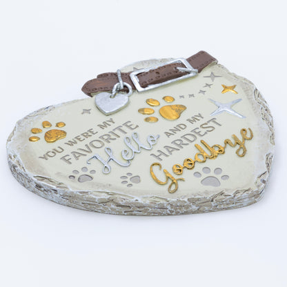 Heart-shaped pet memorial with text and paw prints on a white background