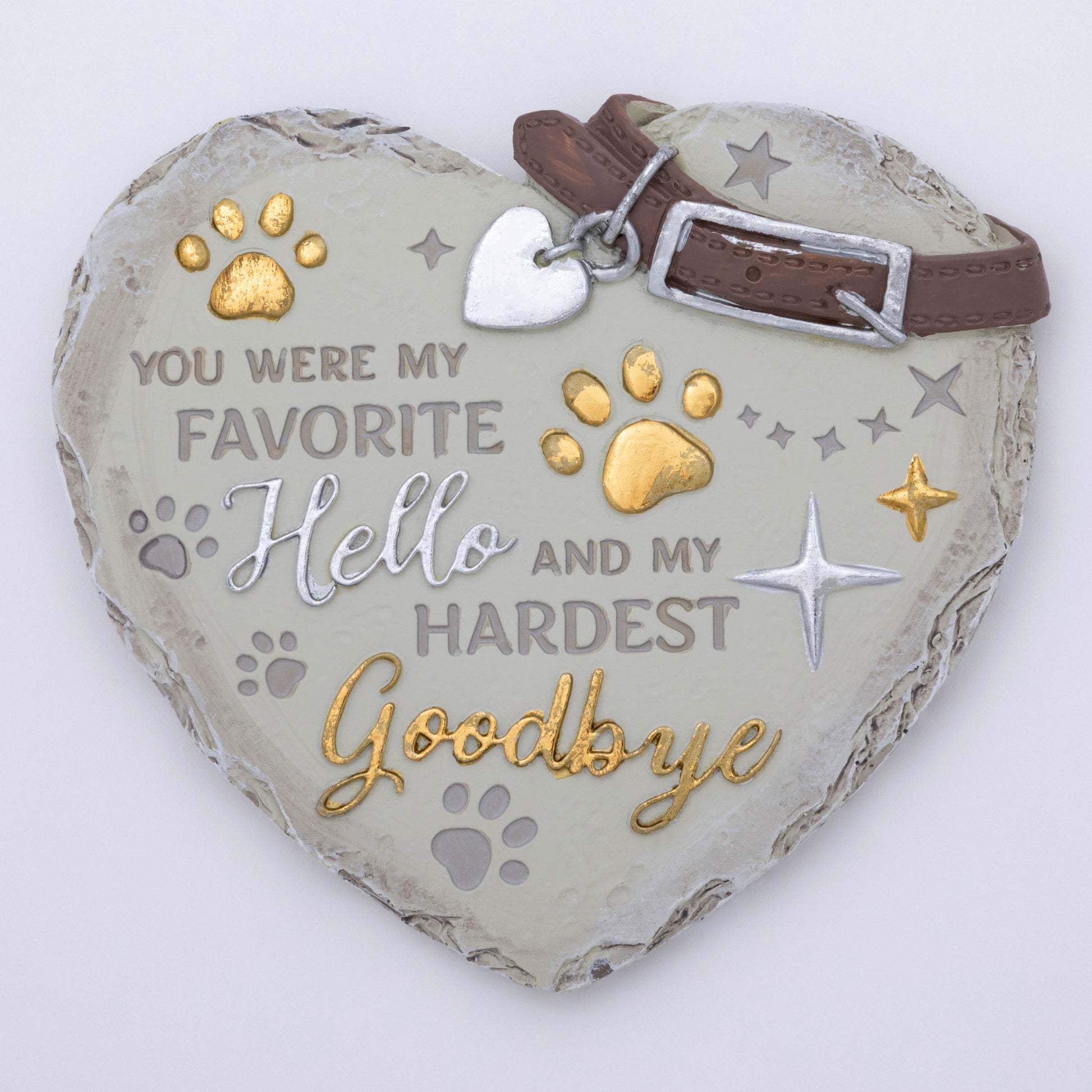 Heart-shaped pet memorial with engraved text and decorative elements on a white background