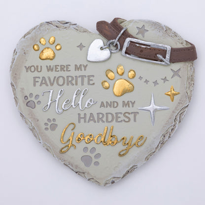Heart-shaped pet memorial with engraved text and decorative elements on a white background