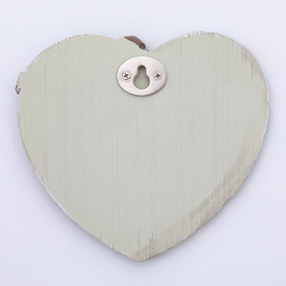 Heart-shaped garden decor with hanging hook on the back, against a white background