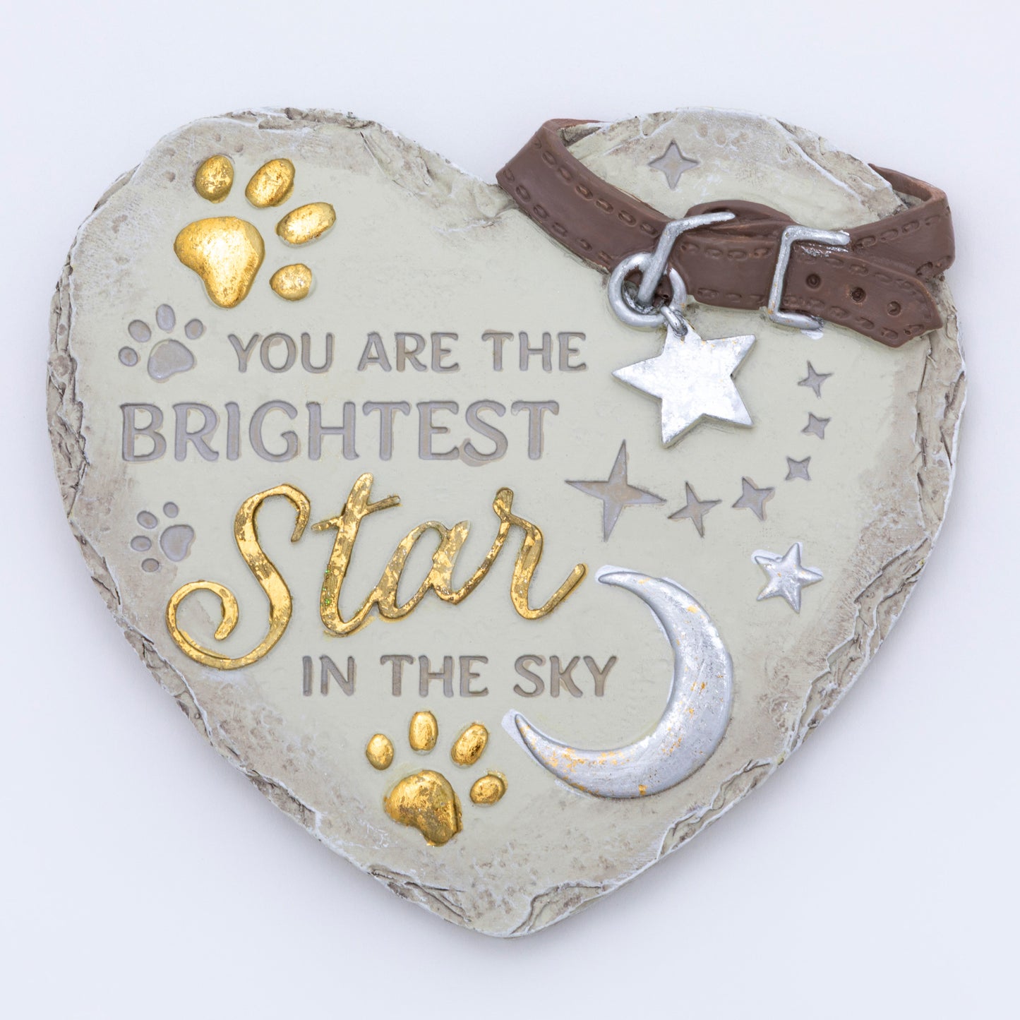 Heart-shaped stone with engraved text and decorative elements on a white background