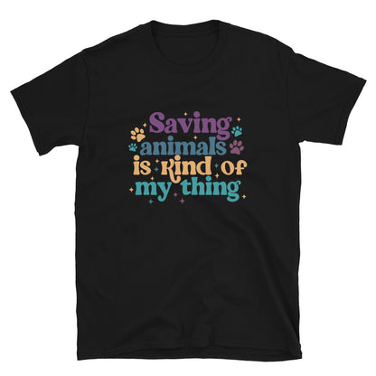 Black shirt that reads Saving Animals is kind of my Thing with several paw print and sparkle images in a purple, yellow and blue font.