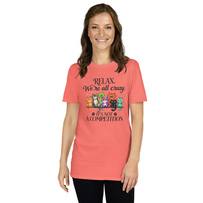 Woman wearing a coral t-shirt with cat illustrations and text on a white background