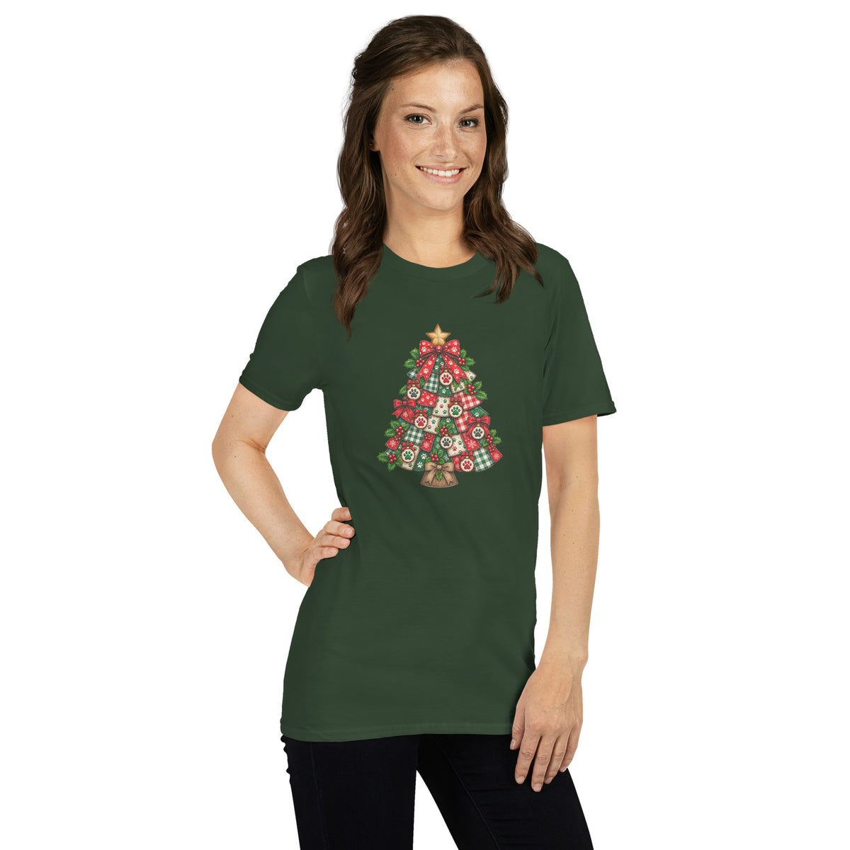 A woman modeling a dark green short-sleeve t-shirt with a colorful Christmas tree graphic made of patterned ornaments on the front, set against a plain white background.
