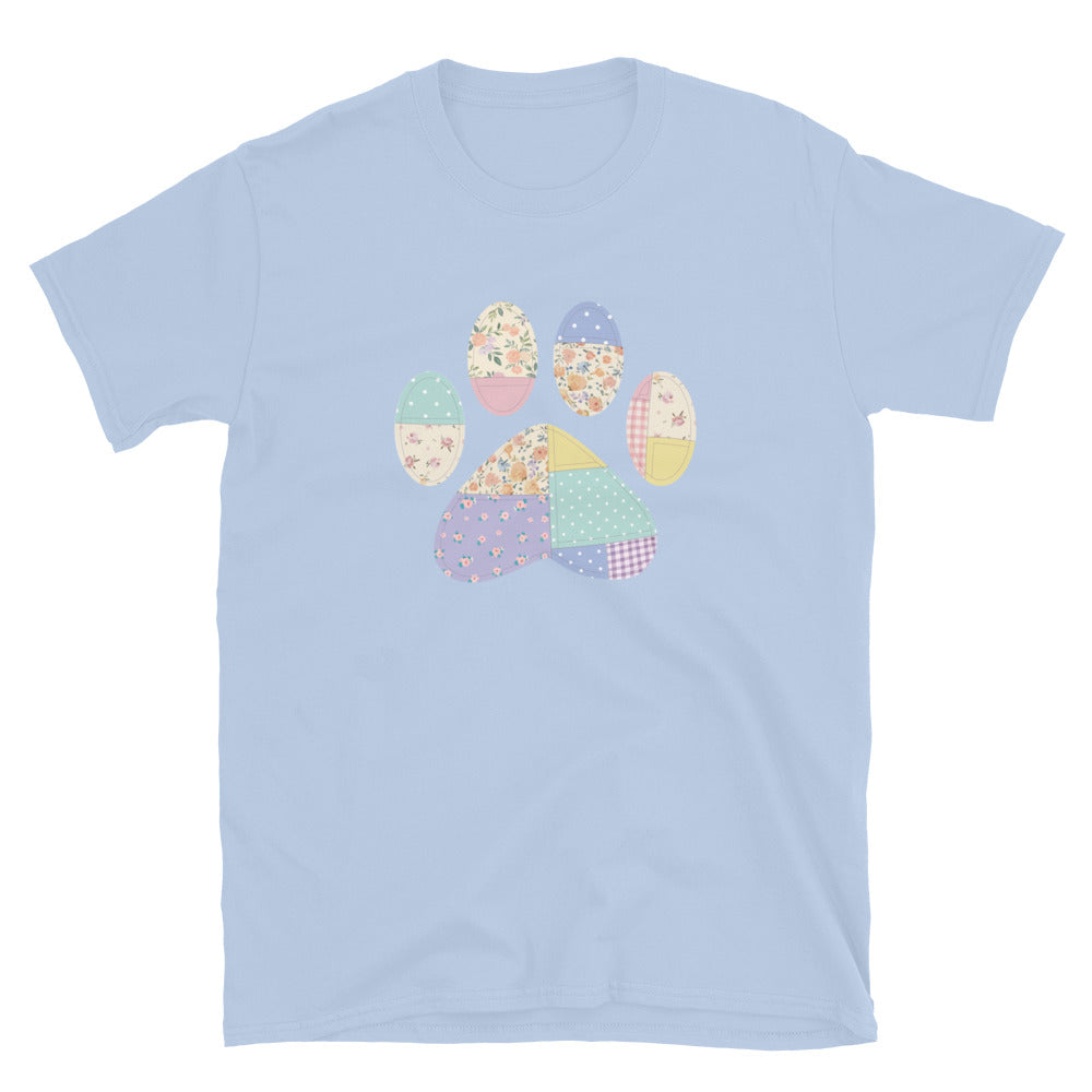 Light blue t-shirt with a colorful paw print design on a white background