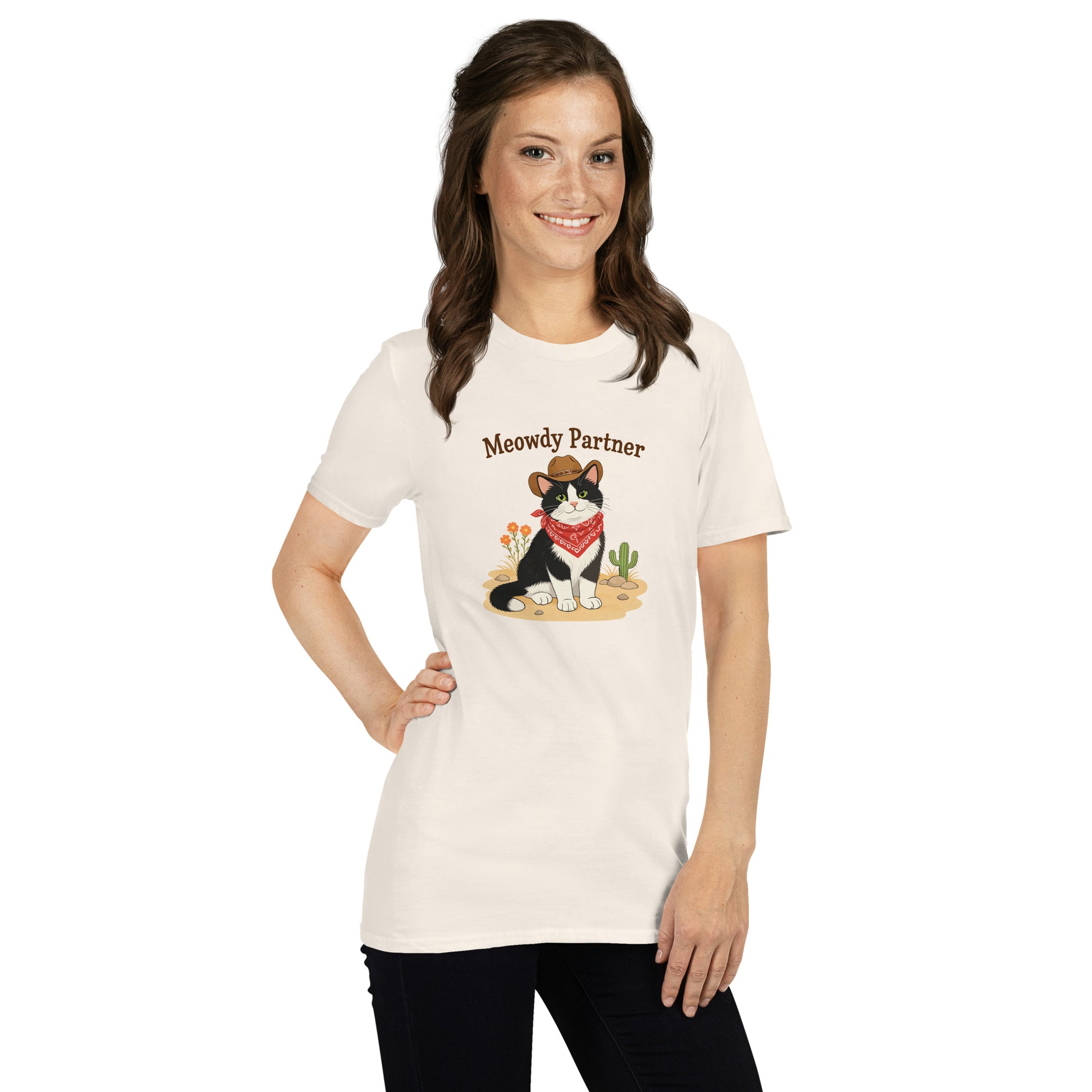 Women wearing a white shirt featuring a cat dressed up as a cowboy that says Meowdy Partner