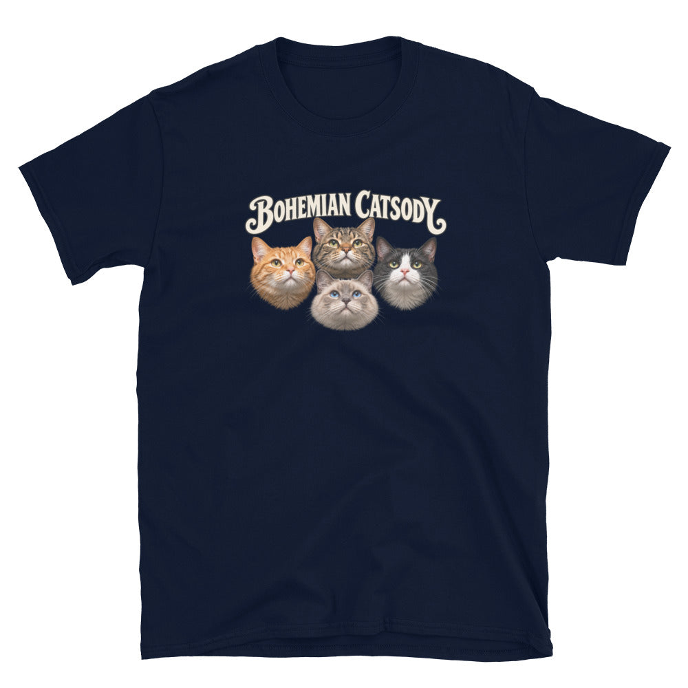 A navy blue short-sleeve t-shirt with a graphic print of four different cat faces and the text 'BOHEMIAN CATSODY' above them, displayed on a clean white background.