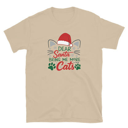 tan Short Sleeve Shirt that reads Dear Santa Bring Me More Cats. Featuring a santa hat, cat ears and cat whiskers with paw prints
